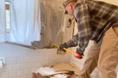 5x8-bathroom-remodel-removing-old-tile-around-tub-3
